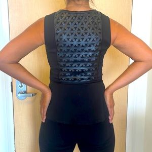JIERU Tailored Black Sheer Midchest Peplum Top with Faux Leather Back